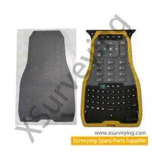 A Replacement Keypad For A Trimble Tsc7 Controller Shown Next To Its Adhesive Backing Sheet.